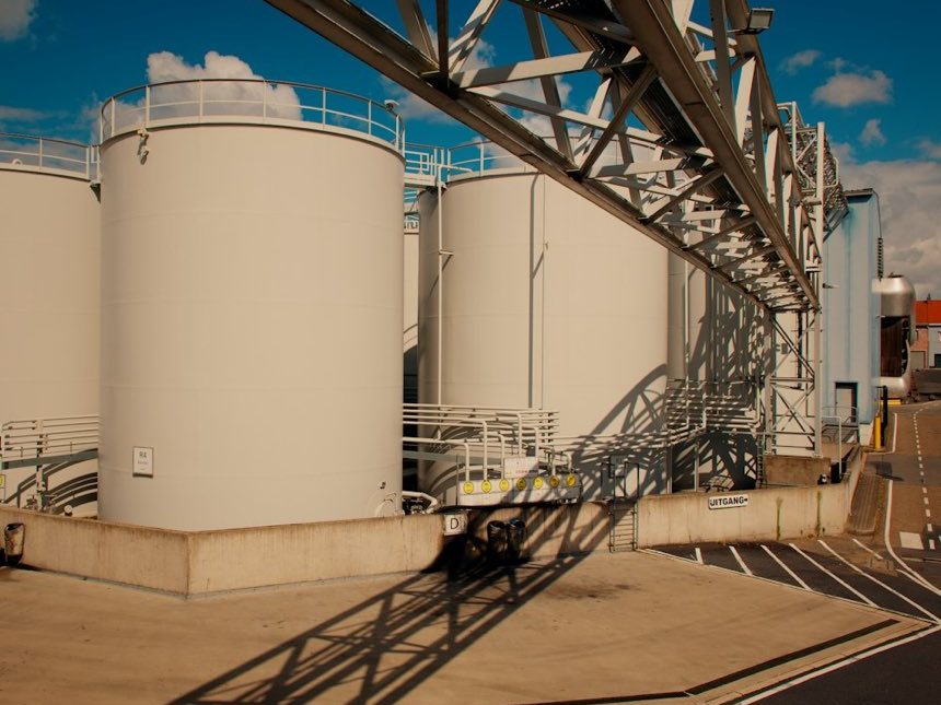 Rows of white bulk liquid storage tanks